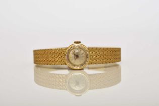 Longines: A lady's 18ct gold bracelet watch