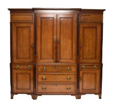 A George III cross-banded oak break-front housekeeper's cupboard