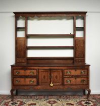 A George III cross-banded oak dresser and rack, Shropshire