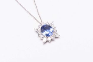 A sapphire and diamond cluster pendant