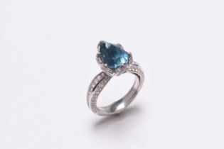 An 18ct white gold blue zircon and diamond ring by Kat Florence