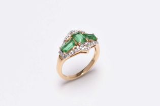 An 18ct gold emerald and diamond ring