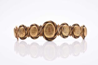 A 19th century woven hair graduated locket bracelet