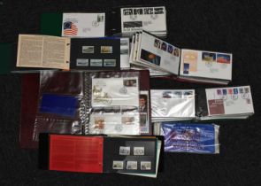 Large box of stamps comprising : Isle of Man, Jersey, Guernsey and GB FDCs and Presentation Packs