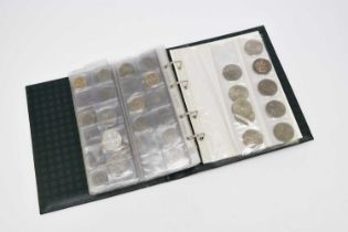 An album containing a collection of approximately 175 UK cupro-nickel and bronze coinage