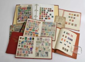 Large accumulation of stamps in a box: stamps on pages in tins, in bag, in binders.