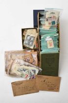 A box of world stamps containing three albums, a small box of stamps in packets and another "off pap