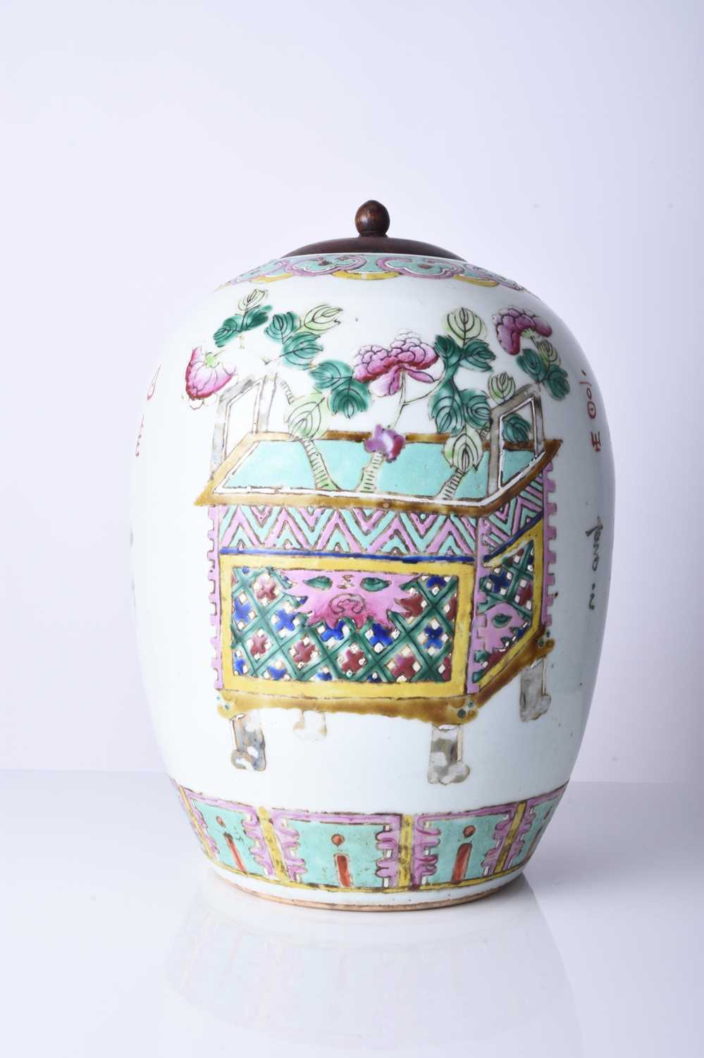 A Chinese famille rose vase with wood cover, 19th century