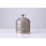An Indian embossed silver powder box and cover, 19th century