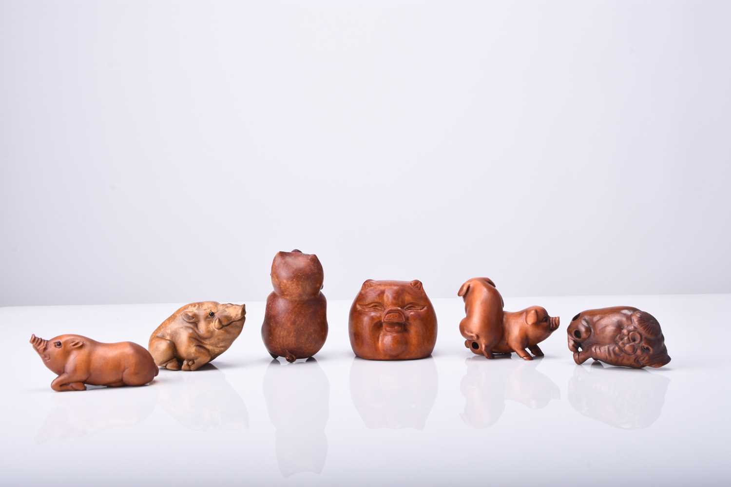 A group of six Japanese wood netsuke of pigs and boars, 20th century - Image 2 of 2