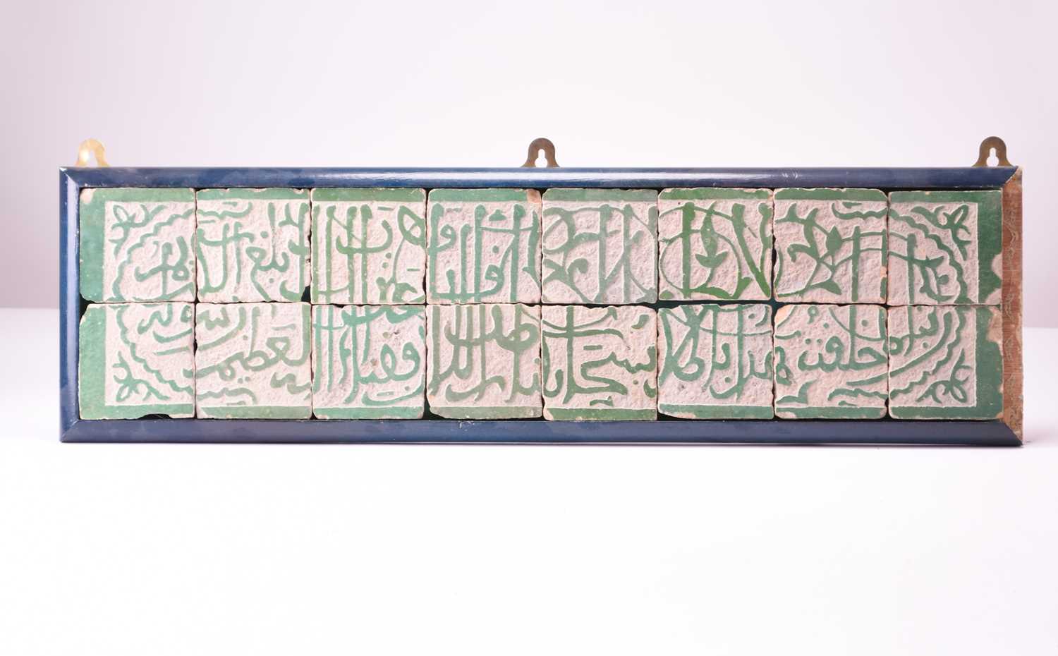 An Islamic etched calligraphic tile panel