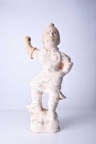 A Chinese buff pottery figure of a guardian