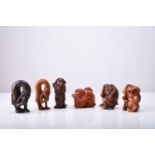 A group of six Japanese wood netsuke of apes and monkeys, 20th century