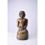 A Burmese gilt bronze figure of a seated monk, late Qing Dynasty