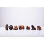 A group of seven Japanese wood netsuke of mythical creatures, 20th century