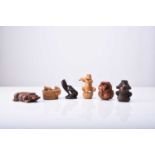 A group of six Japanese wood netsuke of frogs and toads, 20th century