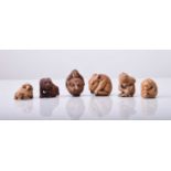 A group of six Japanese wood miniature netsuke, 20th century