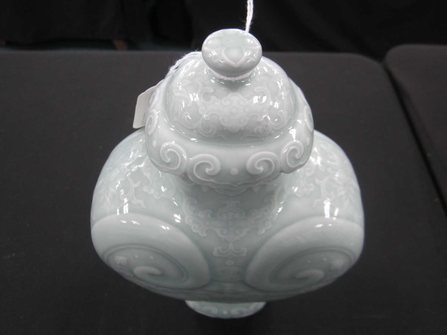 A Chinese carved celadon-glazed Ruyi vase and cover, Qianlong seal mark - Image 7 of 12