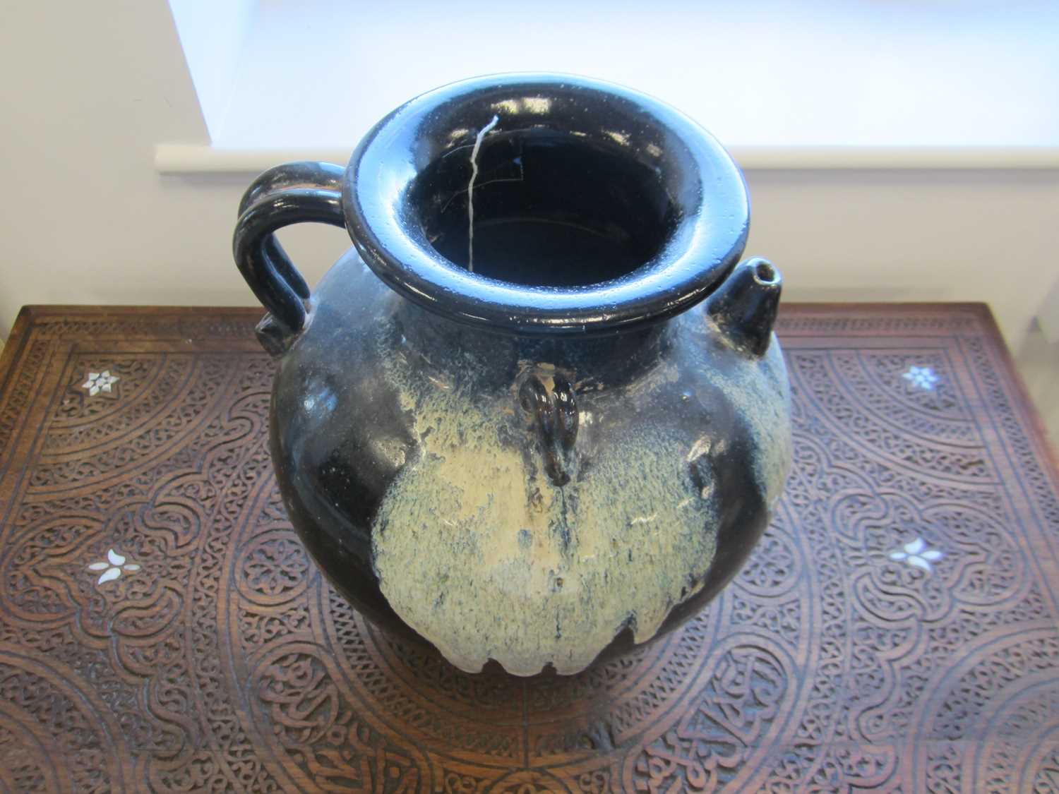 A Chinese Lushan phosphatic splash-glazed ewer, Tang Dynasty - Image 5 of 7