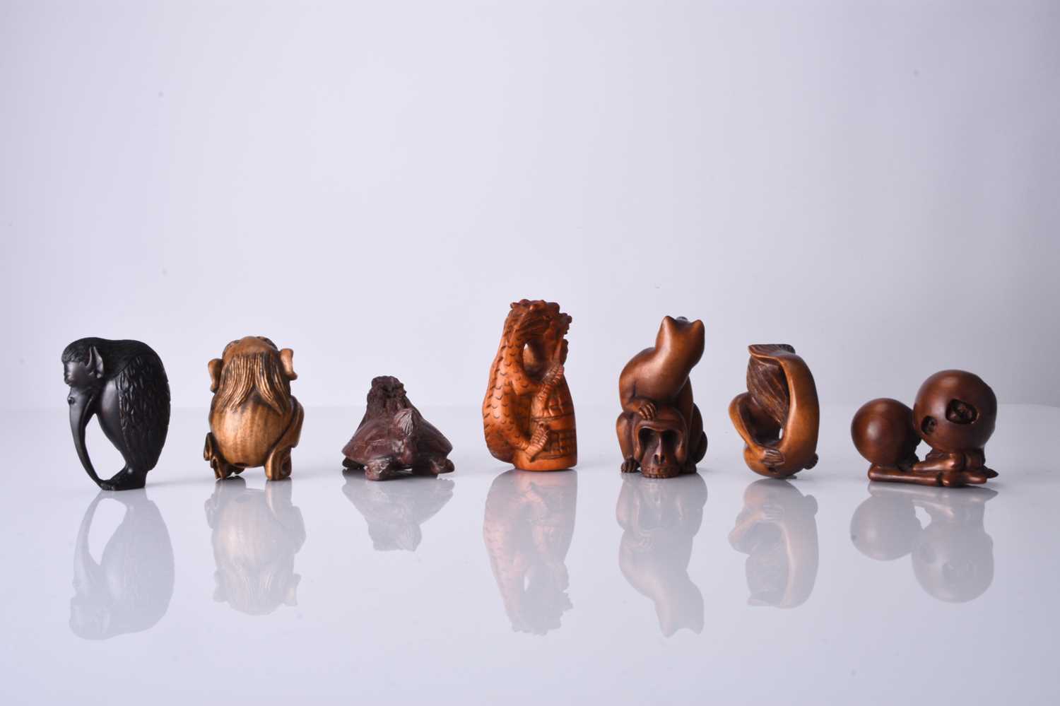 A group of seven Japanese wood netsuke, 20th century - Image 2 of 2