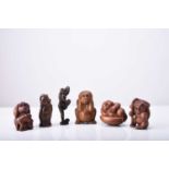 A group of six Japanese wood netsuke of monkeys, 20th century