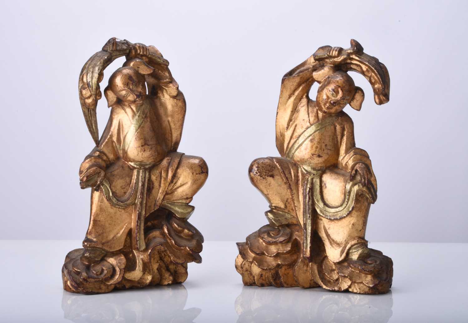 A pair of Chinese gilt wood figures of the twins Hehe Erxian, Qing Dynasty