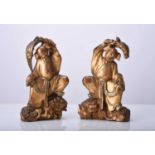 A pair of Chinese gilt wood figures of the twins Hehe Erxian, Qing Dynasty