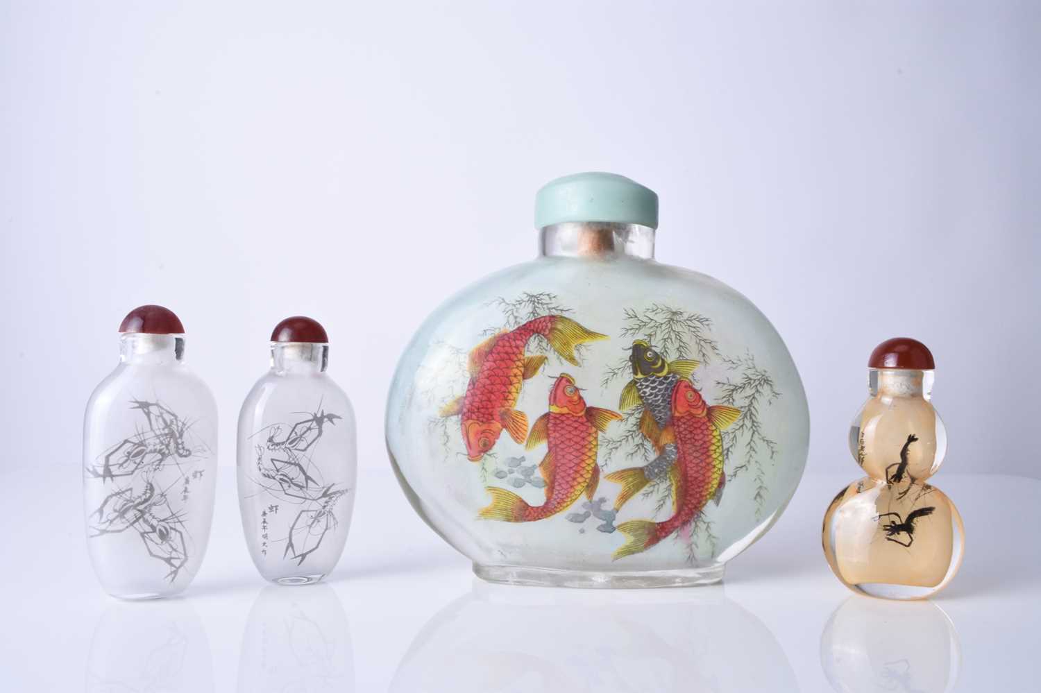 A group of four Chinese internally painted snuff bottles, 20th century