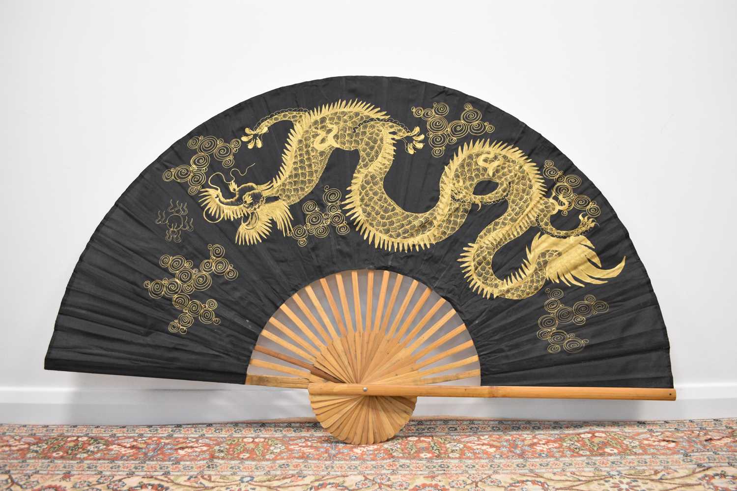 A large decorative painted fan, Thailand, 20th century