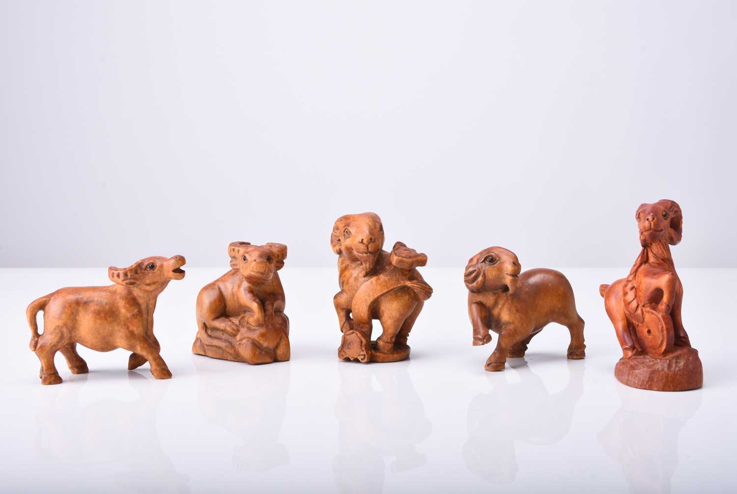 A group of five Japanese wood netsuke modelled as animals, 20th century