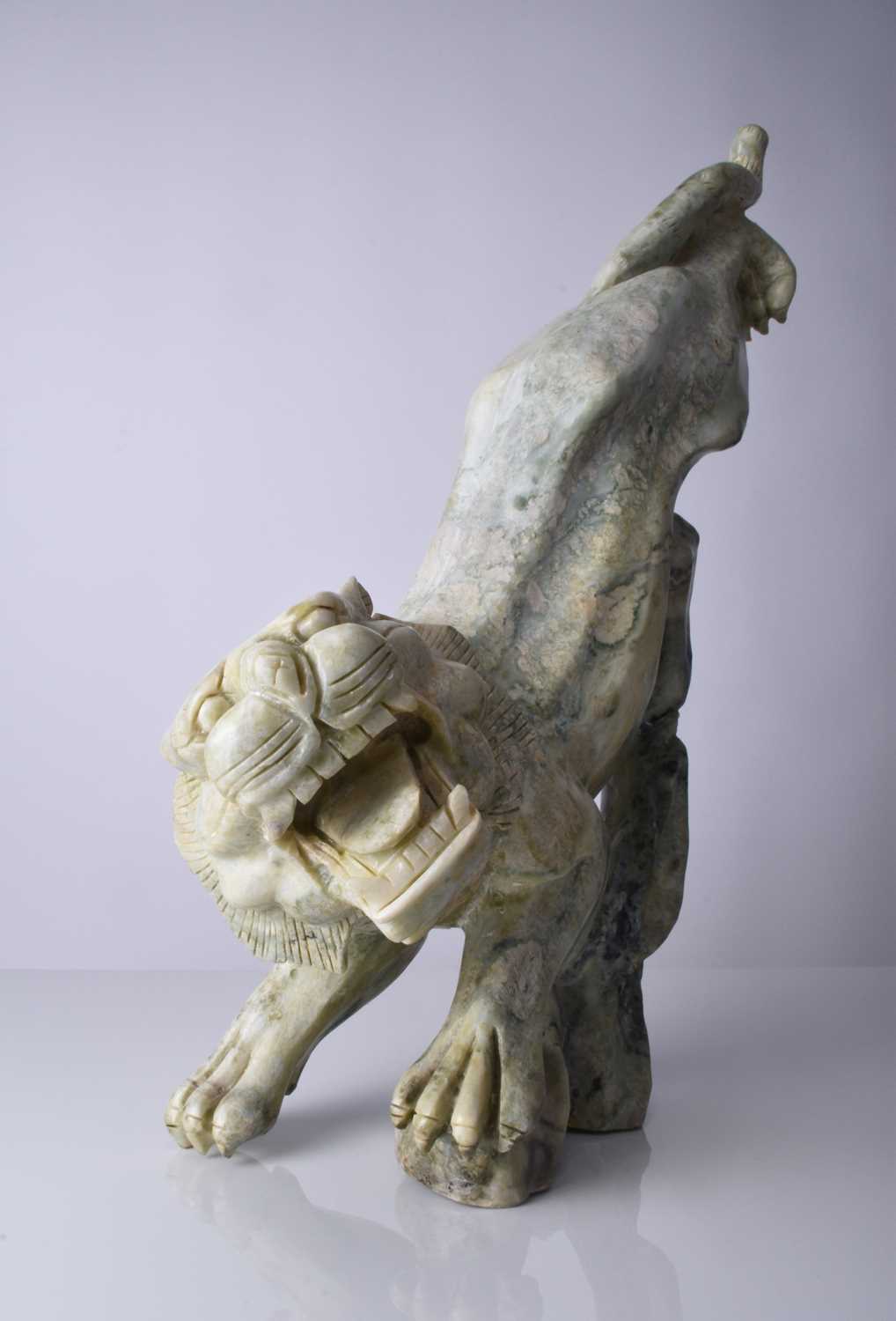 A Chinese carved quartzite figure of a stalking tiger, 20th century