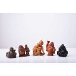 A group of five Japanese wood netsuke, 20th century