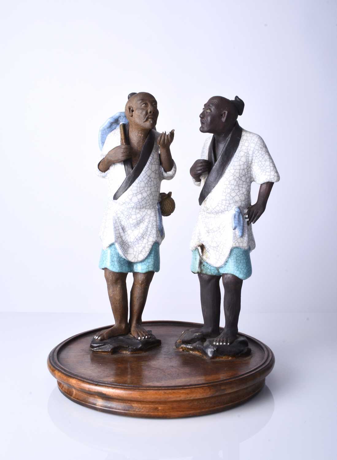 A Chinese pair of Shiwan 'mud' figures, 20th century