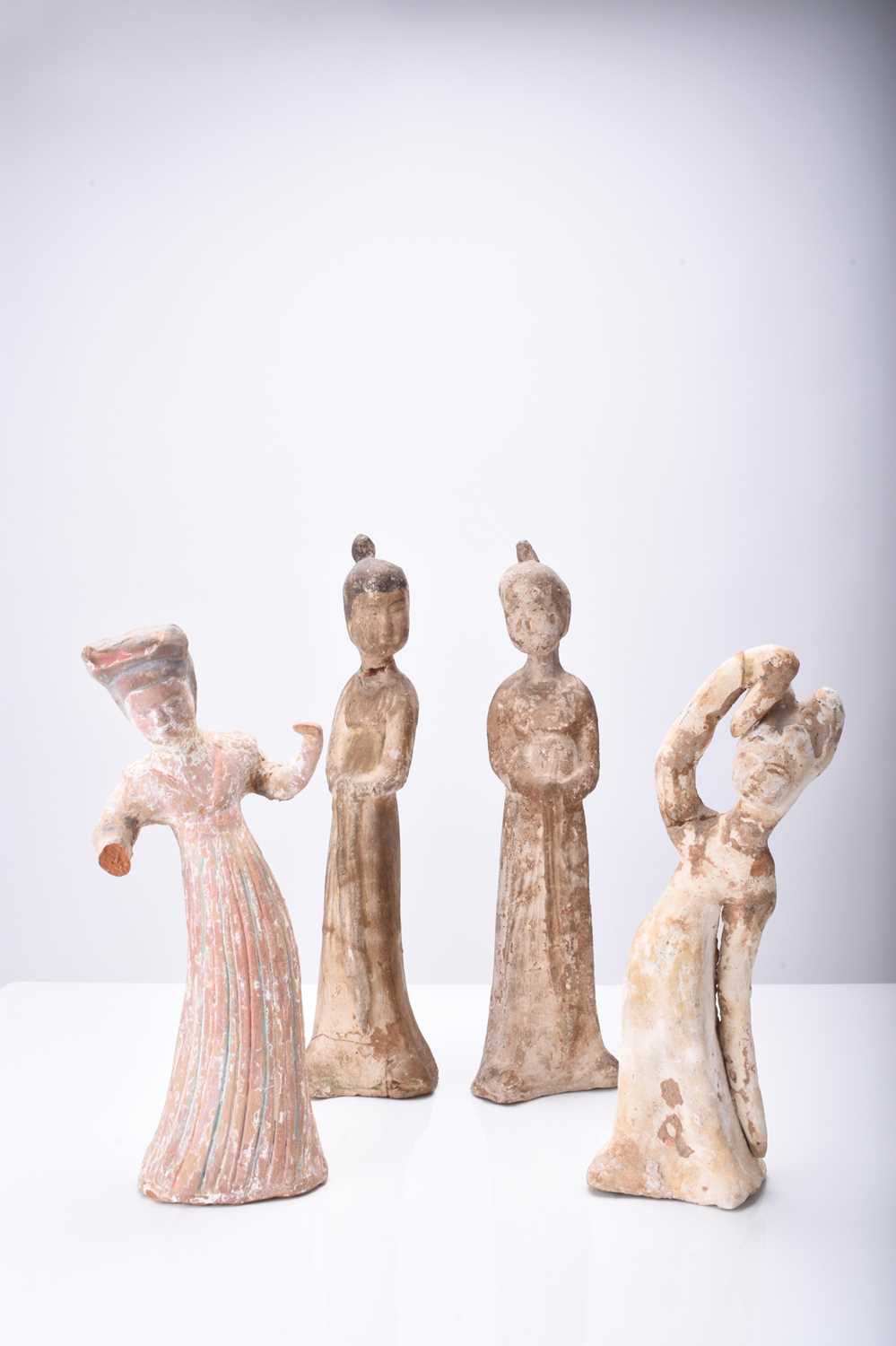 Four Chinese pottery figures of maidens, Tang Dynasty