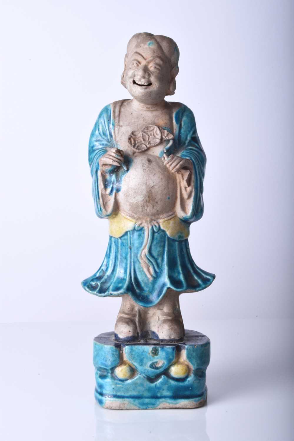 A Chinese sancai glazed figure of an immortal, Ming Dynasty