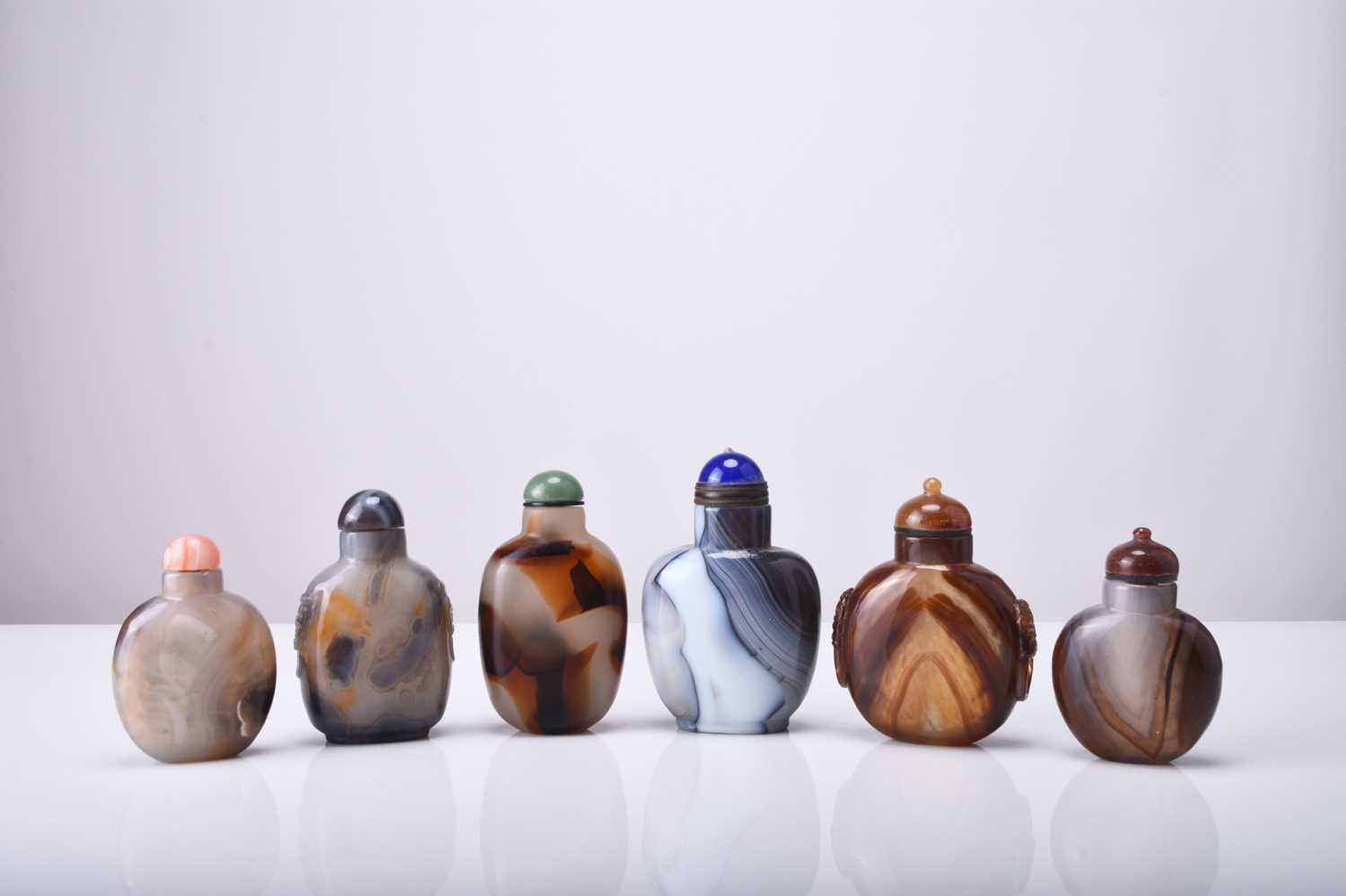 A group of six Chinese agate snuff bottles, 19th/20th century