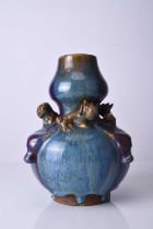 A Chinese relief moulded flambe vase, early 20th century