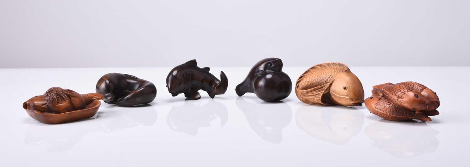 A group of six Japanese wood netsuke of sealife, 20th century