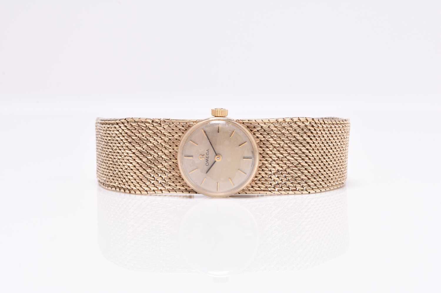 Omega: A lady's 9ct gold bracelet watch