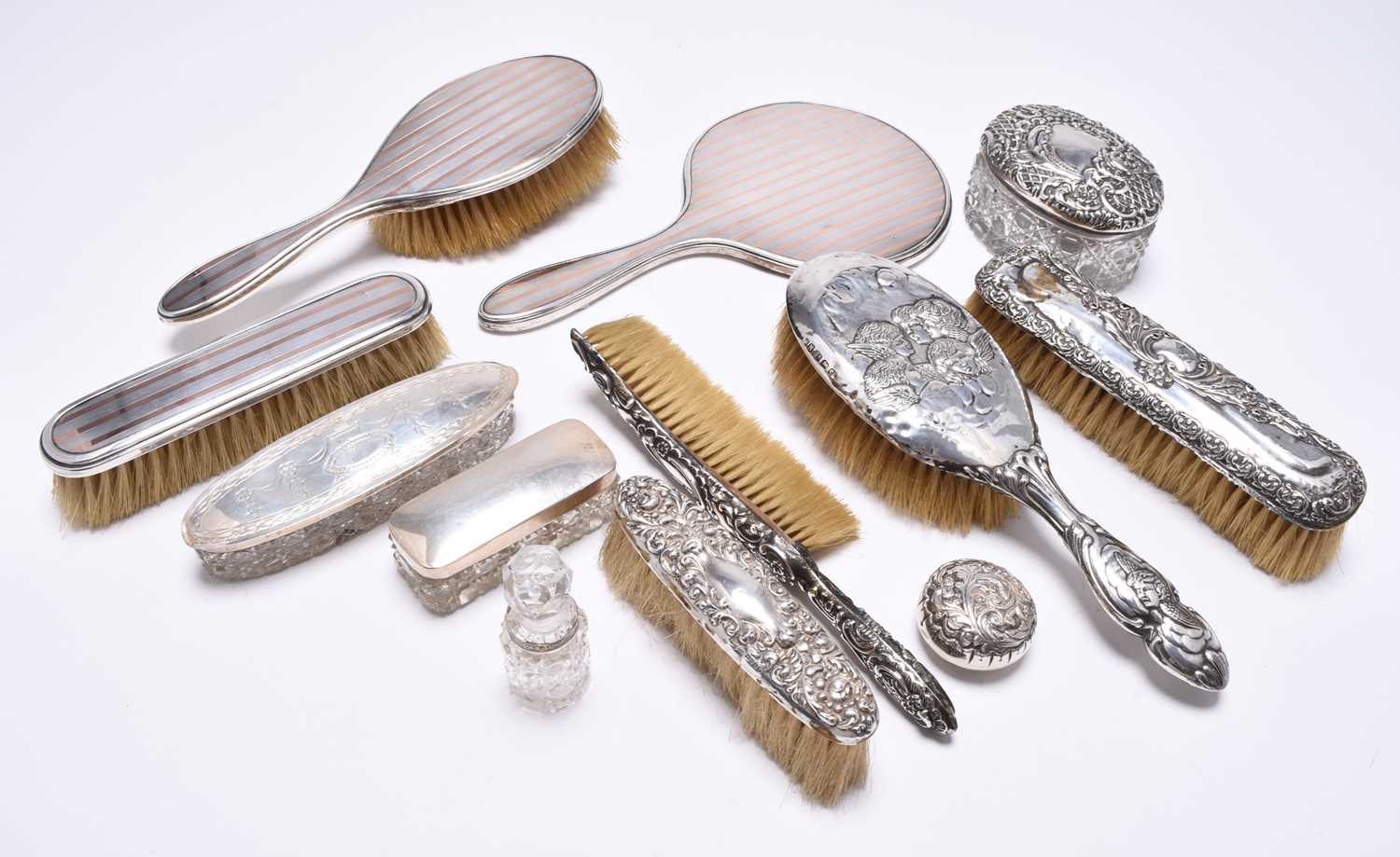 A collection of silver mounted dressing table wares
