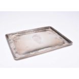 A silver dressing table tray