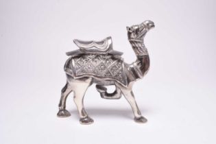 A white metal model of a camel