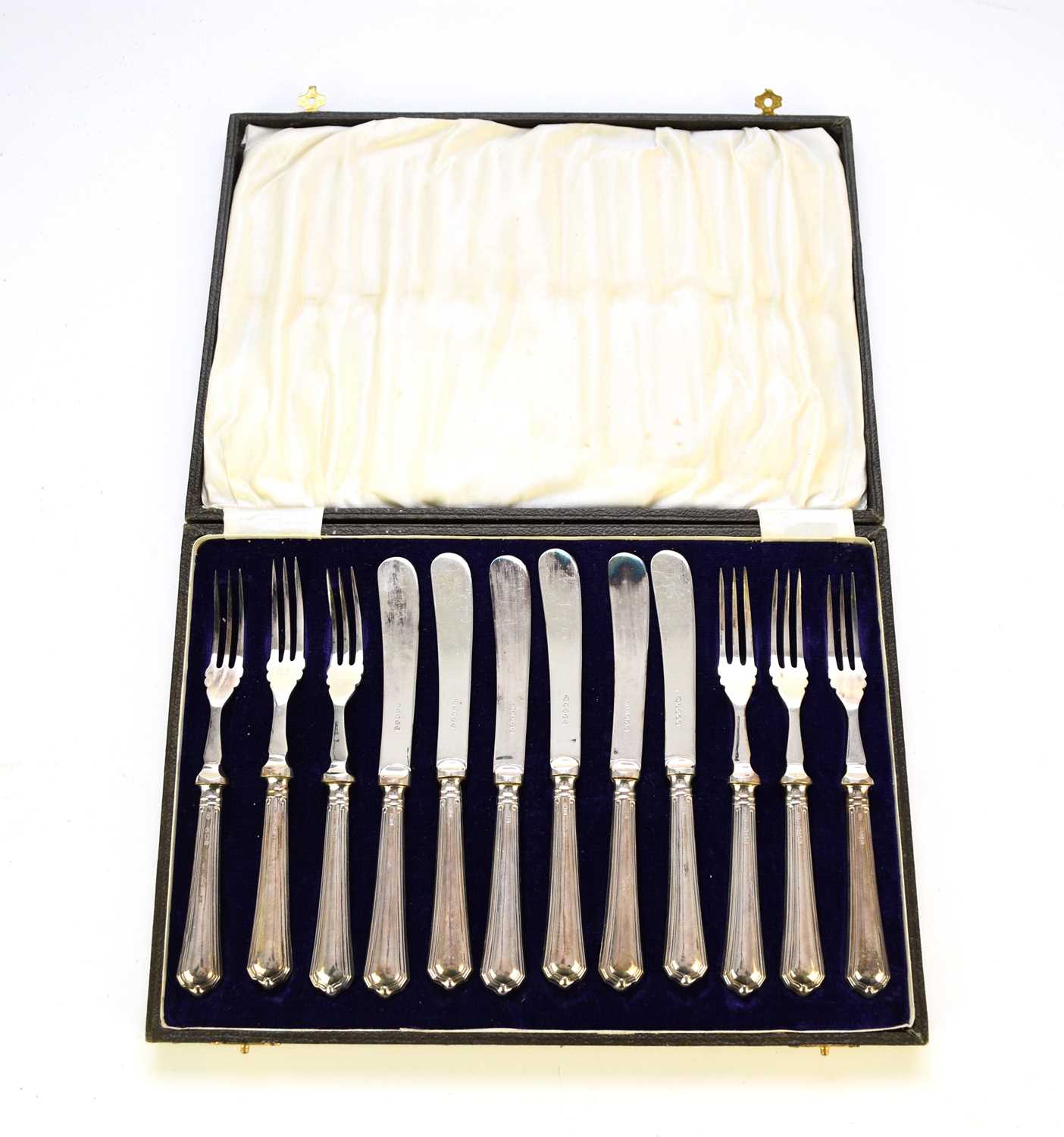 A cased set of twelve silver handled fruit knives and forks