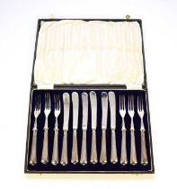 A cased set of twelve silver handled fruit knives and forks