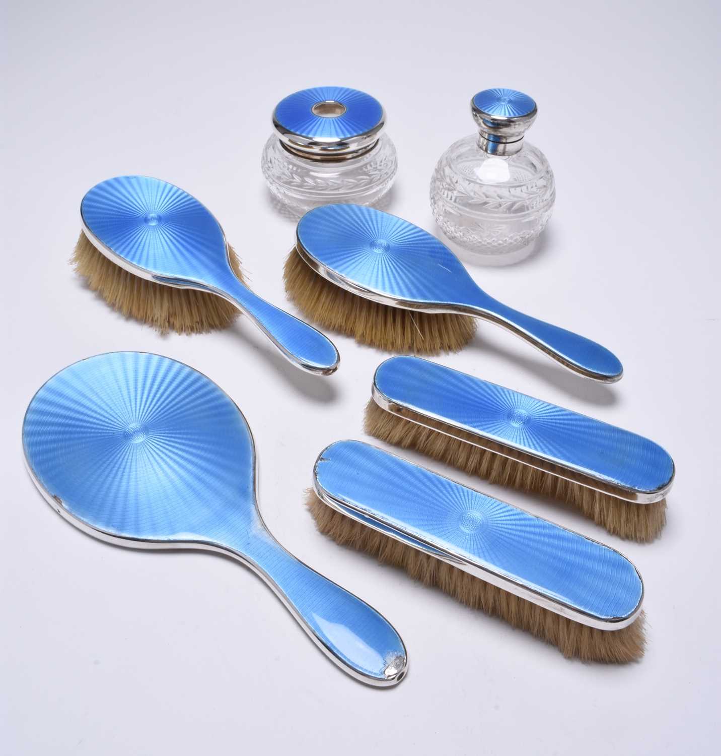 A seven piece silver and blue guilloche enamel mounted dressing table set