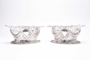 A pair of Edwardian oval pierced silver bowls