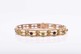 An early 20th century peridot and amethyst set bracelet