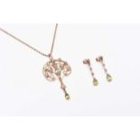 A peridot and seed pearl pendant and a pair of earrings