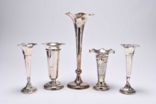 A collection of silver vases