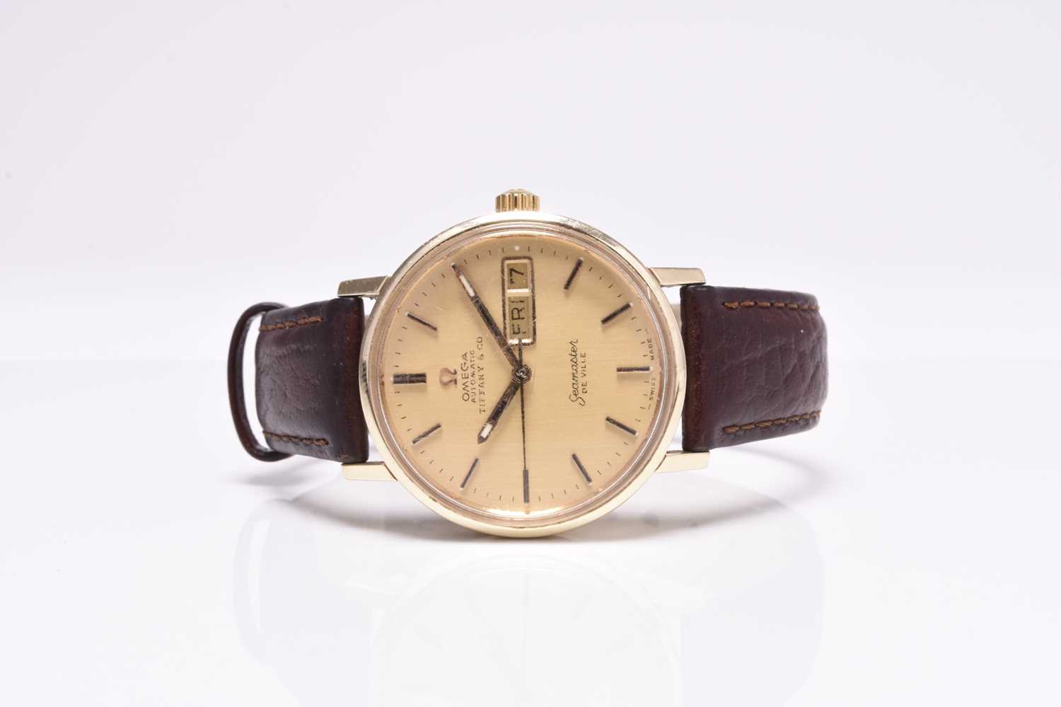 Omega: A gentlemans's gold Seamaster De Ville Tiffany automatic wristwatch